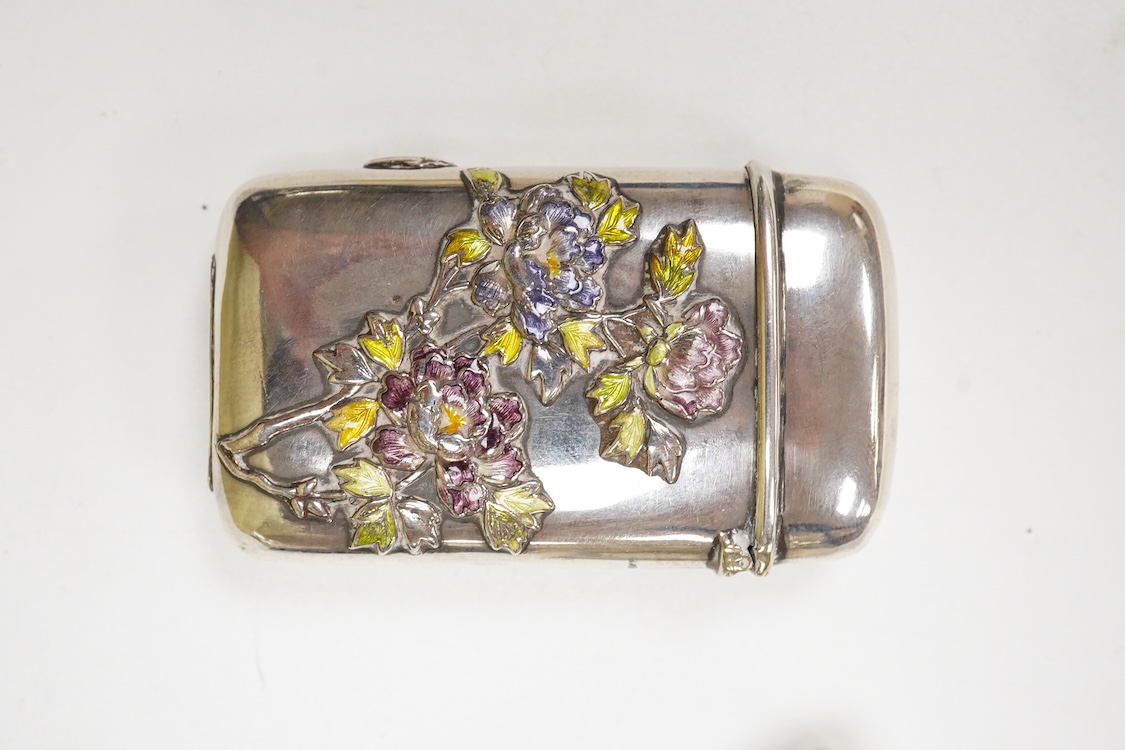 A Japanese white metal and polychrome enamel vesta case, decorated with flowers and butterfly, 56mm, together with a 19th century Russian 84 zolotnik and niello snuff box(tired), a modern silver pill box and a silver mou